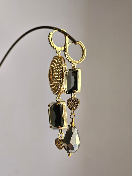 Orecchini sole di strass e fumo