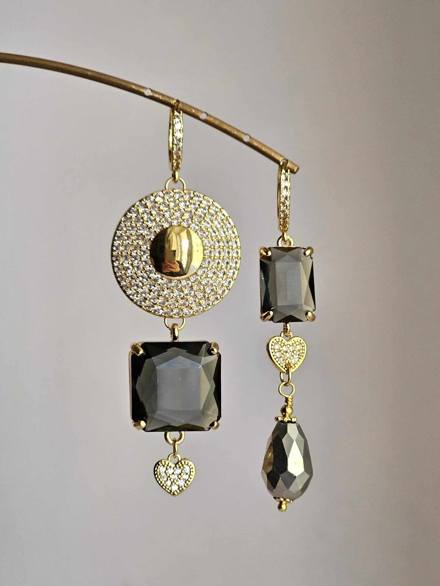 Orecchini sole di strass e fumo