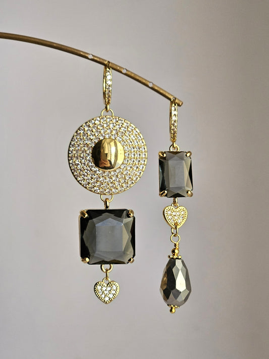 Orecchini sole di strass e fumo