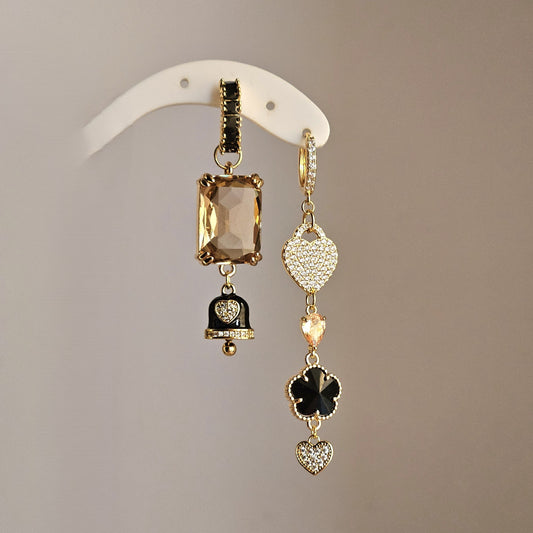 Orecchini nero champagne cuori strass e bell