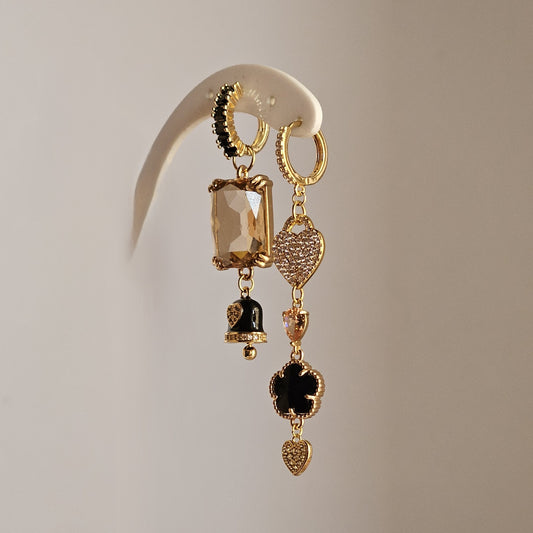 Orecchini nero champagne cuori strass e bell